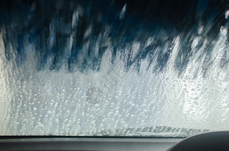 自动洗车司机车辆化学品视角有效率清洁剂点缀车轮泡沫里程表背景图片