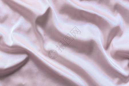平滑的 优雅的粉色丝绸和柔软的折叠可用作背景纺织品海浪概念布料投标衣服图像织物折痕材料背景图片
