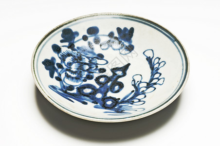抽打瓷瓷盘子蓝色历史性古董背景图片