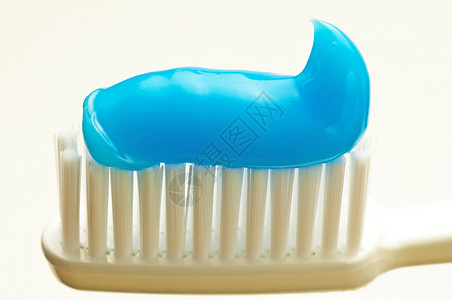 牙刷牙科卫生口腔宏观蓝色预防牙膏刷子白色背景图片