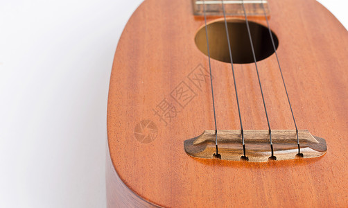 Ukulele 白色背景的音乐乐器文化指板物体娱乐家庭细绳岛屿艺术设备民间背景图片