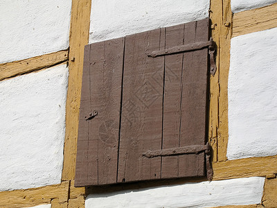 包头木梁孵化木材房子乡村木质框架房屋光束赭石背景图片