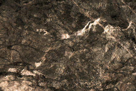 古老的锈铜花岗岩石表面的洞穴内部大理石床单侵蚀奢华火山墙纸橙子岩石花纹花岗岩背景图片