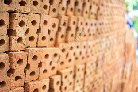 橙色砖用于建筑材料 层层叠叠砖块工程师插图建筑水泥黏土风化石头工人材料背景图片