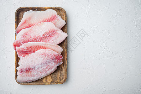 白色背景的冷冻白鱼片 顶视图 有复制文本空间食物粉色白鱼海鲜文字背景图片