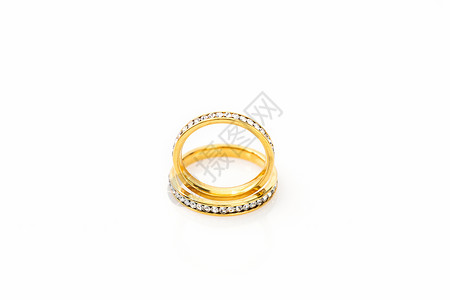 订婚金戒指白色背景的黄金结婚戒指钻戒金子订婚宝石新娘金带婚姻婚礼水晶钻石背景
