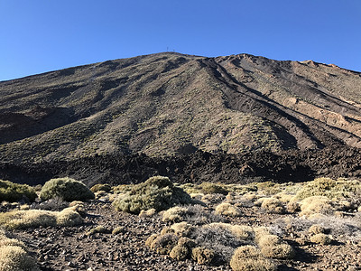 迭层山月亮火山蓝天岩石太阳顶峰高清图片