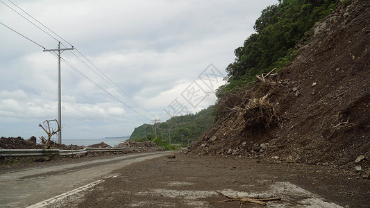 山路上的滑坡 菲律宾卡米吉岛灾难国家小路碎片路线危险土地封锁石头岩石损害高清图片素材