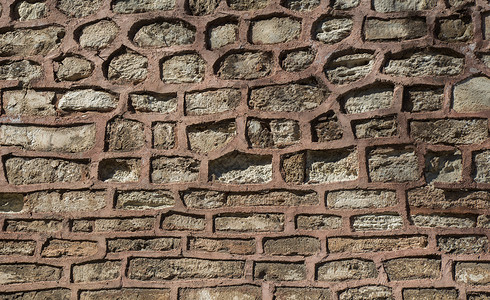 用同种石头砌成的墙建造地面背景建筑学历史卵石砖块墙纸岩石建筑背景图片