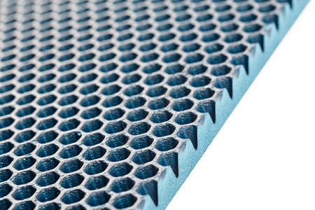 蓝色六角形穿孔 EVA乙烯醋酸乙烯酯泡沫地毯线性透视背景 有选择的焦点六边形橡皮墙纸塑料打孔边缘材料蜂窝地板细胞背景图片