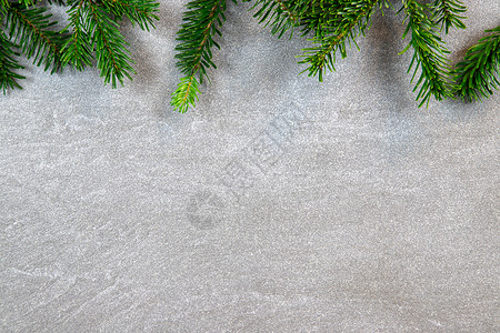 圣诞图案纹理背景 顶部是诺德曼冷杉的树枝 深灰色大理石背景 有文本的可用空间植物墙纸白色大理石纹松针绿色背景图片