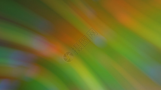 与彩虹亮点的抽象模糊的绿色背景彩虹色黄色艺术明信片坡度背景图片