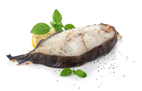 烤鱼牛排海鲜白色美食黄色柠檬鲶鱼盘子食物黑色胡椒背景图片
