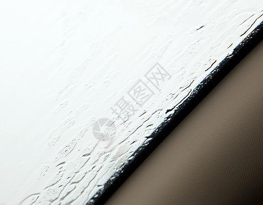 车窗下雨环境挡风玻璃蒸汽蓝色水滴窗户液体天气玻璃滚动条背景图片