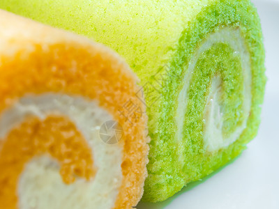 绿色板兰和橙色口味蛋糕派对小吃夫妻面包食物餐厅绿色水果美食早餐背景图片