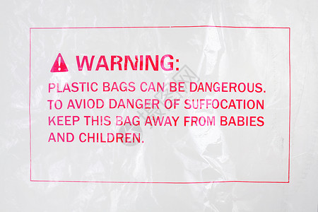 塑料袋上的警告符号背景图片