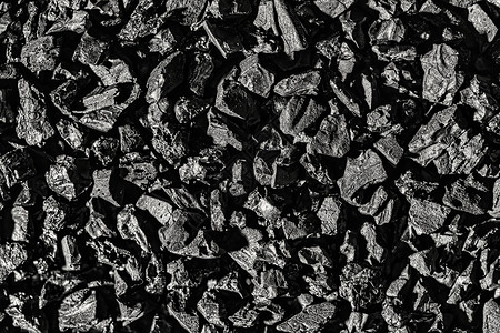 特写活性炭纹理 椰炭吸水性清洁木质颗粒剂质地药品黑色活性粒状木炭背景图片