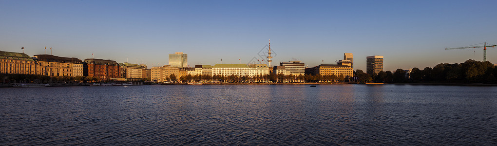 海因里希汉堡的书目池塘日出房子建筑学地标城市反射天际旅行市中心背景