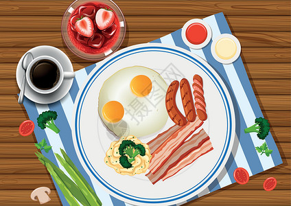 新鲜早餐牛角包盘子里放着鸡蛋和培根 边上放着饮料设计图片