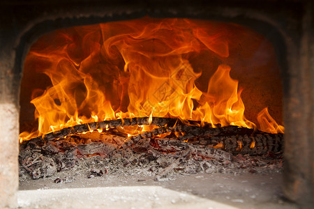 木柴炉灶烹饪壁炉木头餐厅烧伤红色食物火焰温度燃烧背景图片