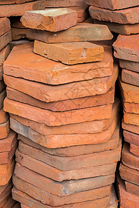 用于建筑的库存砖头负荷材料积木石工公寓劳动者砖墙历史房子石头建筑学背景图片