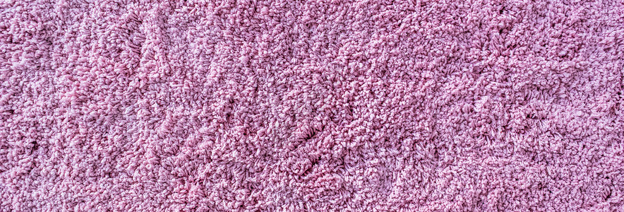 长绒地毯质地 粗野的粉红色纤维的抽象背景小地毯棉布墙纸织物毛皮地面家庭地毯紫色毛巾背景