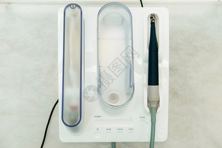 牙科办公室的超声波缩压器 牙科概念涡轮治疗机器乐器橡皮手术工具超声波卫生打扫背景图片