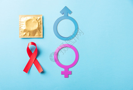 环形标志艾滋病毒 艾滋病癌症认识 带影子的避孕套和男性 女性性别标志等红领结符号丝带蓝色安全环形疾病帮助癌症丝绸避孕世界背景