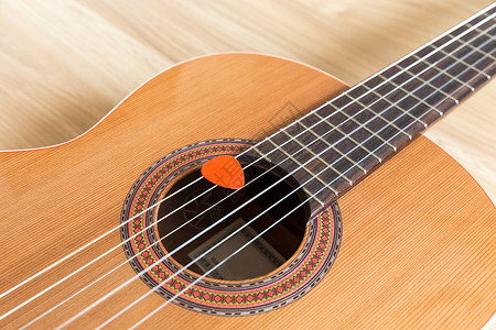 吉他语木头爱好吉他字符串乐器成人民间流行音乐国家音乐家背景图片