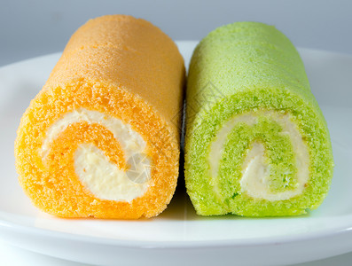绿色板兰和橙色口味蛋糕味道甜点水果午餐美食白色餐厅绿色小吃夫妻背景图片