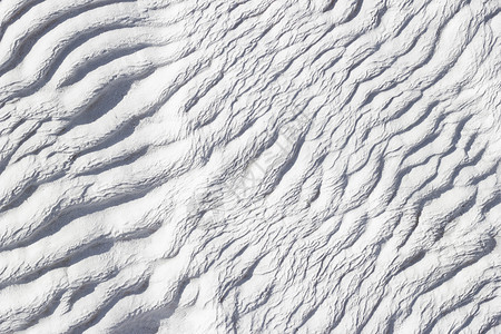 土耳其棉花堡钙钙华的白色抽象纹理背景图片