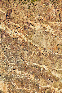 棕色和 ta 悬崖壁的细节纹理背景图片
