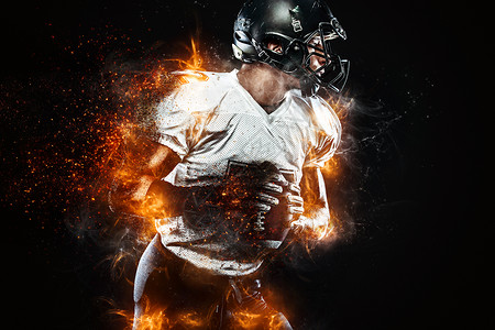 戴头盔的美国足球运动员手上有球 火情背景 团队体育 运动壁纸赛跑者玩家男人体育场竞赛力量黑暗行动游戏竞技背景