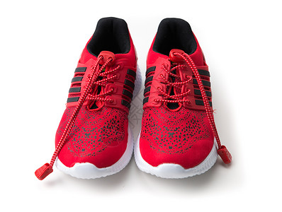 带黑色条纹的亮红色跑鞋斑点鞋带运动员能力创造力运动鞋类娱乐赛跑者培训师背景图片