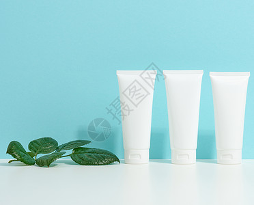 用于化妆品的空白塑料管 奶油 凝胶 血清 广告和产品促销的包装 模拟阴影塑料洗发水桌子卫生推广治疗清洁剂身体皮肤背景图片