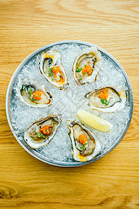 生生和新鲜牡蛎贝壳加柠檬生蚝熟食美食食物石头海鲜盘子贝类背景图片