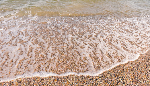 岸上泡沫软波背景图片