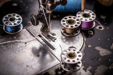 缝纫机详情生产金属工厂精神工作女裁缝卷轴古董棉布缝纫背景图片