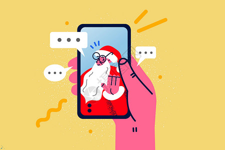 老年人用手机与圣诞老人用手机进行视频电话交谈的人设计图片