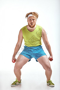 红发 胡胡子 大胖子抓着那些哑铃动机运动装运动男性管状成人损失手套健身房胡子背景图片