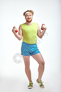红发 胡胡子 大胖子抓着那些哑铃减肥运动重量男人男性运动装管状身体生活动机背景图片