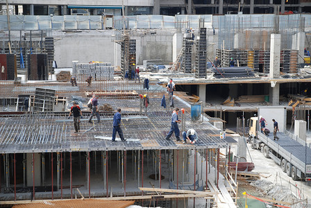 建筑建筑工人太阳人士工地男性杂工工作交易蓝色安全帽职业背景