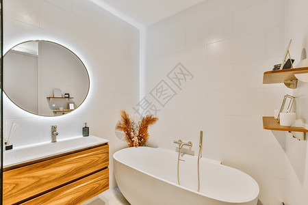 用大圆光照镜子打孔的卫生间淋浴龙头风格房子奢华浴缸住宅房间装饰公寓背景图片