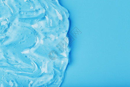 海浪中蓝色背景的抗菌凝胶奶油保健皮肤蜗牛洗发水血清唾液剂量胶原肥皂背景图片