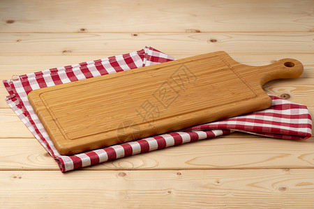 木制桌上用棉餐巾布切割板餐厅材料空白家庭亚麻厨房纺织品烹饪木头托盘背景