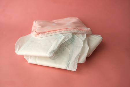 以粉红背景为主的卫生巾剪裁高清图片素材