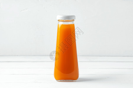 白色背景上小玻璃杯新鲜果汁瓶玻璃蔬菜瓶子婴儿饮食排毒产品水果液体饮料背景图片