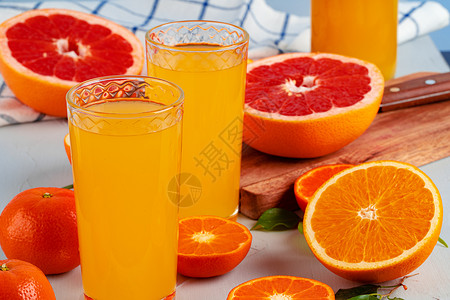 桌上的橙汁杯子关门了食物饮料桌子水果玻璃橙子饮食黄色果汁背景图片