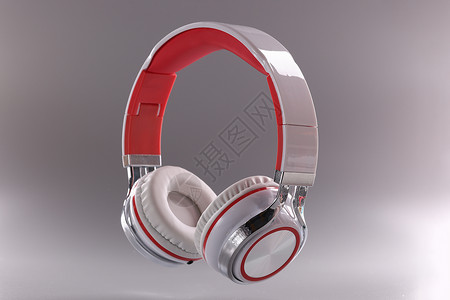 灰色背景红白混合的现代耳机(以红色和白色组合方式使用)背景图片
