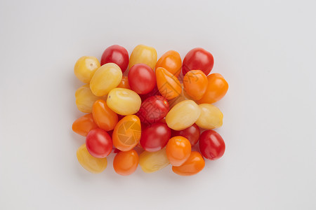 黄 橙和红樱桃西红柿红色食物黄色小吃白色饮食橙子蔬菜背景图片